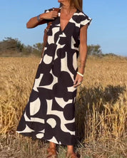 CLAIRE | Maxi-mekko painatuksella ja V-pääntiellä