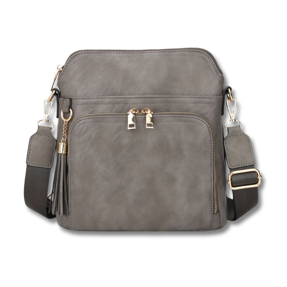 Elevate your style with the chic anti-theft Natalie crossbody bag, featuring trendy fringe accents.