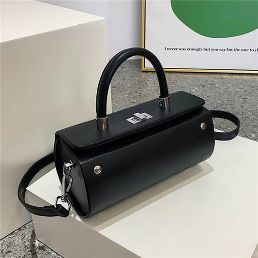 Franzyn | Sac bandoulière en forme de cylindre à élégance intemporelle