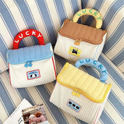 Alianna | Trousse de maquillage matelassée avec porte-bonheur
