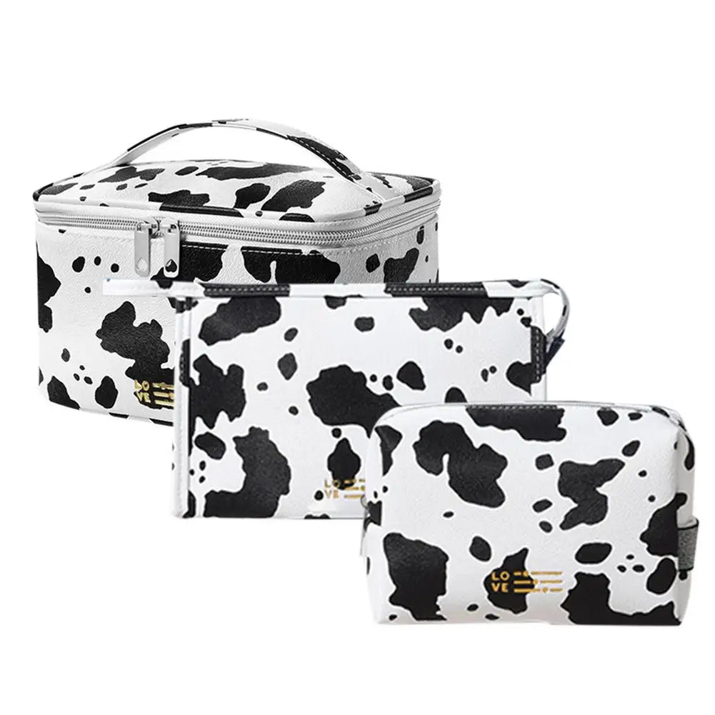 Magdalena | Vesitiivis PU-nahkainen meikkilaukku lehmänkuviolla