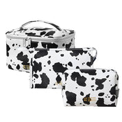 Magdalena | Vesitiivis PU-nahkainen meikkilaukku lehmänkuviolla